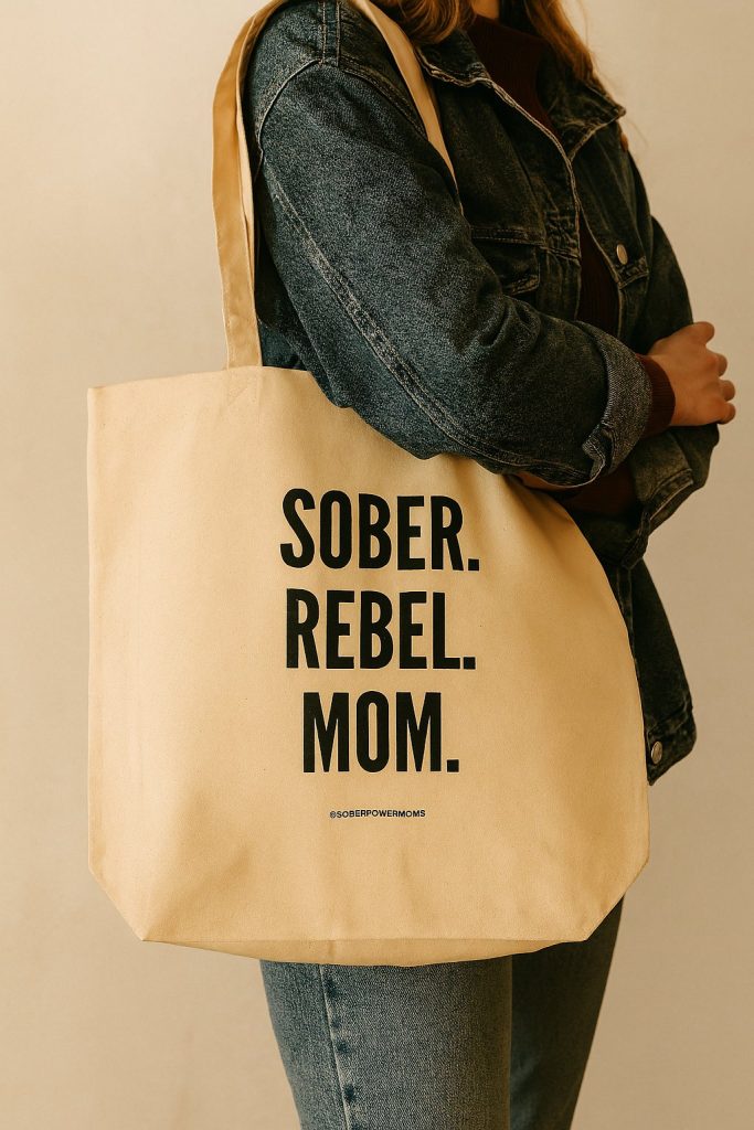 woman wearing sober rebel mom tote bag